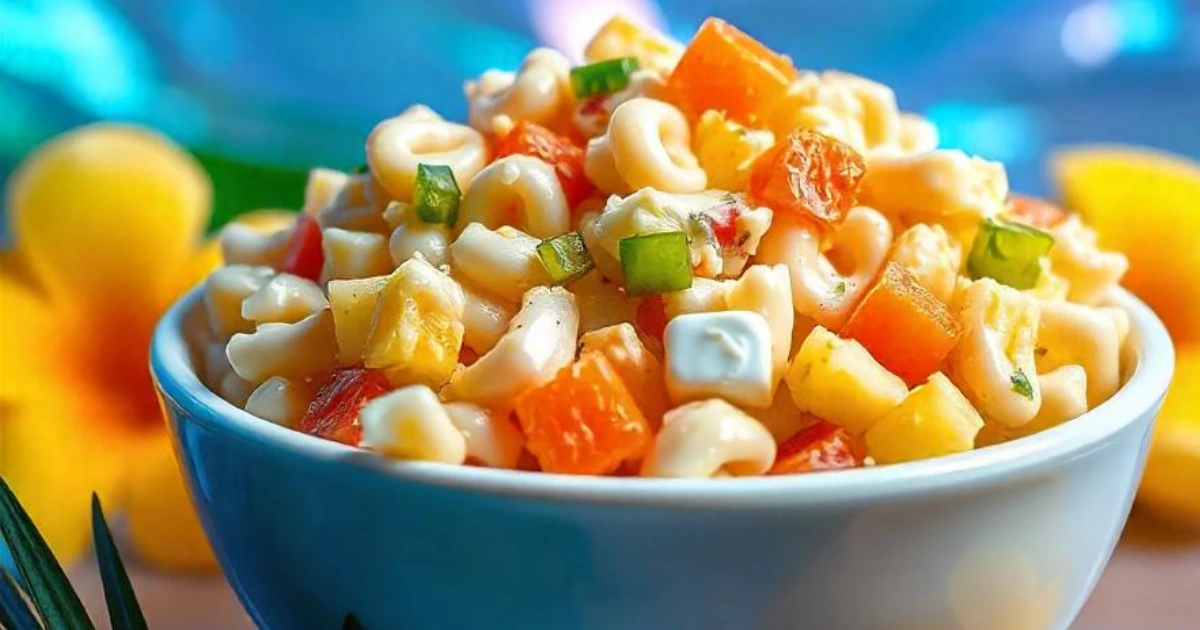 Hawaiian macaroni salad with pineapple, carrots, and creamy dressing in a bowl